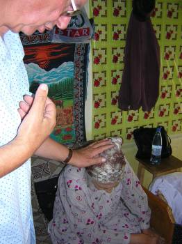 Before we commence evangelizing, we show others that we are concerned for their well-being.  To that end, Caleb Ministries fosters many projects to help those facing disasters as well as those needing a helping hand to improve their lives.  Praying with a sister in Greci Village, Romania